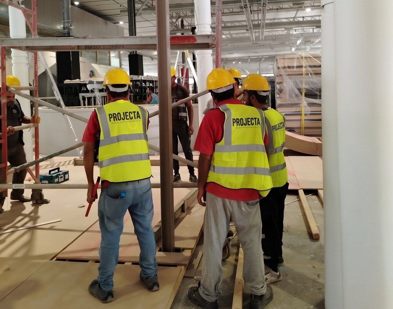 PROJECTA crew in high-visibility vests coordinating work on site